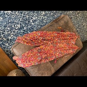 Red floral harem jumpsuit, size small, good condition.